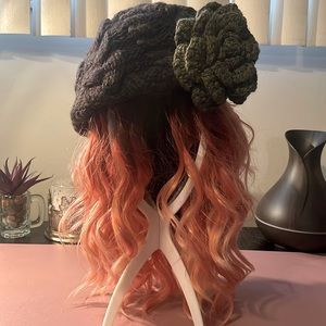 NWOT knitted deep brown slouchy cap with olive green flower accent. By Mojo Spa.